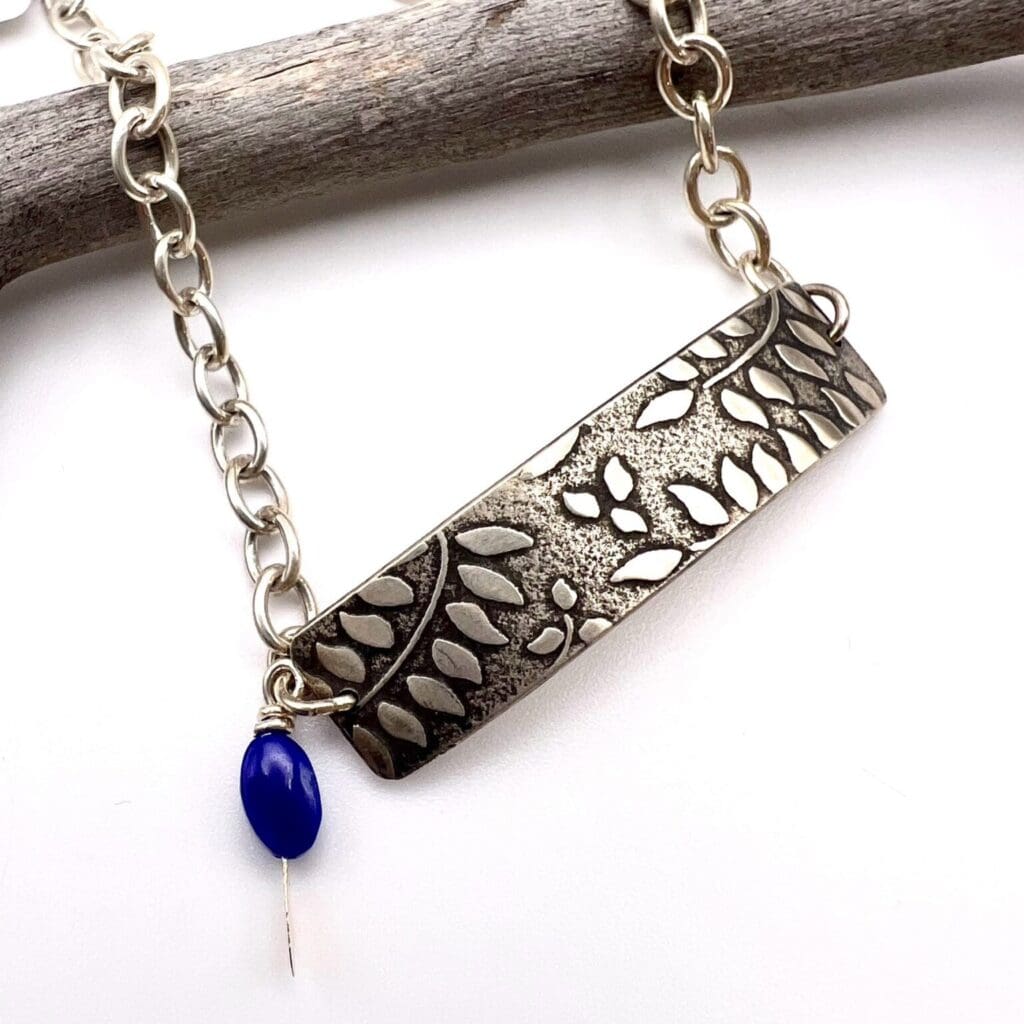 Make Your Own Jewelry Craft & Sip Salida Jewelry Design Studio Shop - leaf stamped rectangle pendant with blue stone